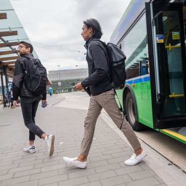 Person getting off the bus