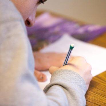 Person writing on paper