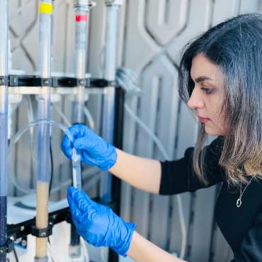 Reseacher testing water