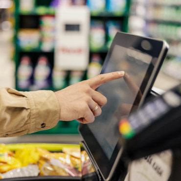 Person using self-checkout
