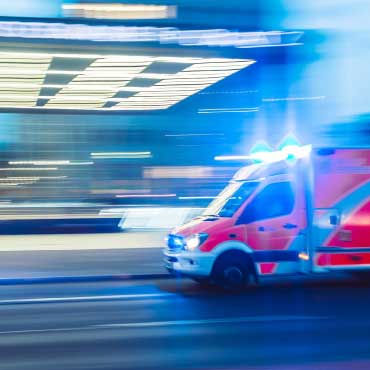 Ambulance driving down street