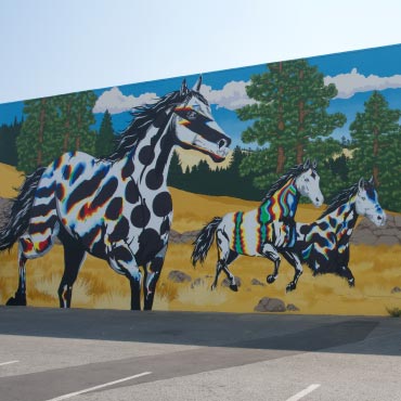 Mural of horses running.