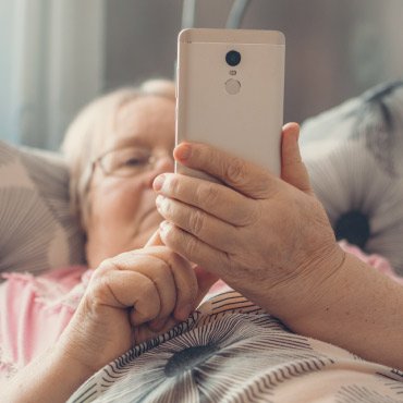 Older woman looking at a mobile phone