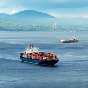 Two cargo ships on the water