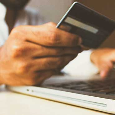 Hand holding a credit card