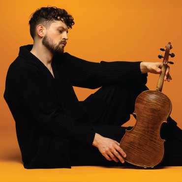 UBC professor Ryan Davis with his violin