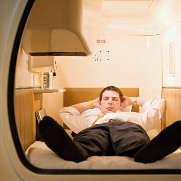 Person sleeping in a capsule