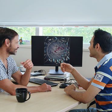 Dr Gino DiLabio and doctoral student Hossein Khalilian discussing their research