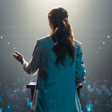 Person presenting on stage