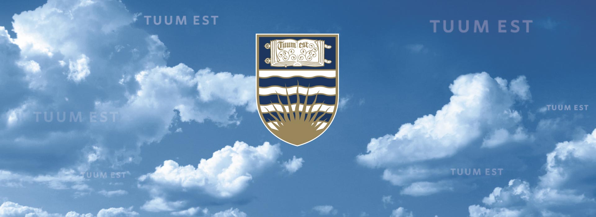UBC Coat of Arms with sky background.