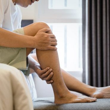 Person holding their calf